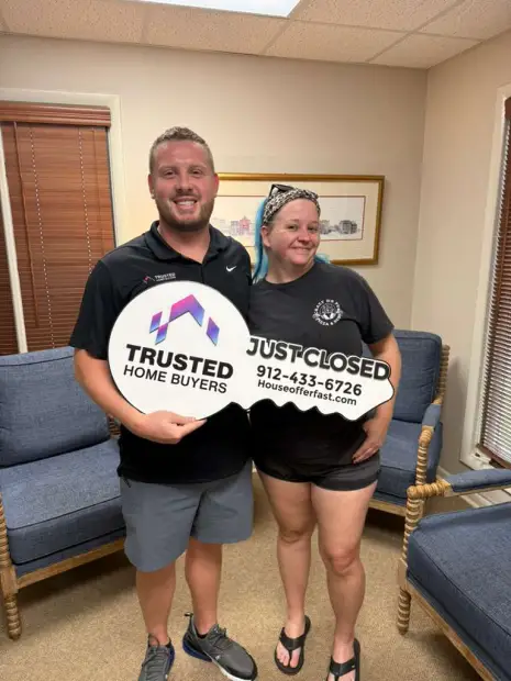 Seller who sold their property to Trusted Home Buyers, pictured at closing