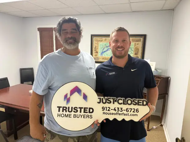 Seller who sold their property to Trusted Home Buyers, pictured at closing