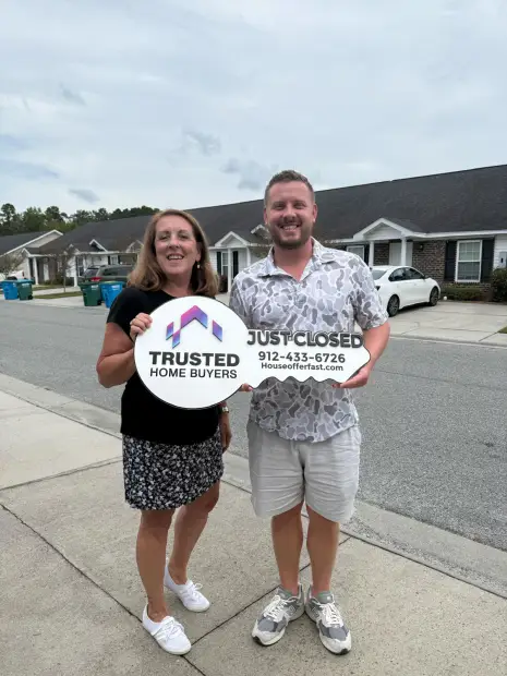Seller who sold their property to Trusted Home Buyers, pictured at closing