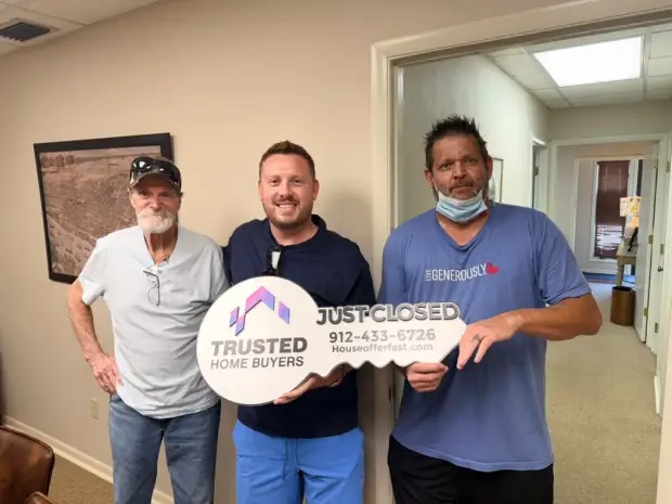 Seller who sold their property to Trusted Home Buyers, pictured at closing