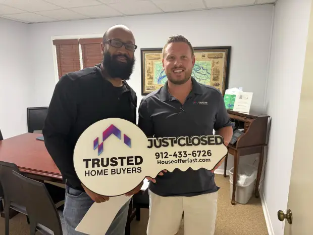 Seller who sold their property to Trusted Home Buyers, pictured at closing