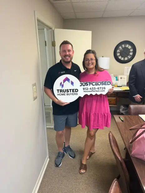 Seller who sold their property to Trusted Home Buyers, pictured at closing