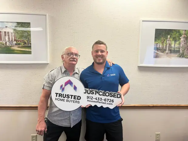 Seller who sold their property to Trusted Home Buyers, pictured at closing