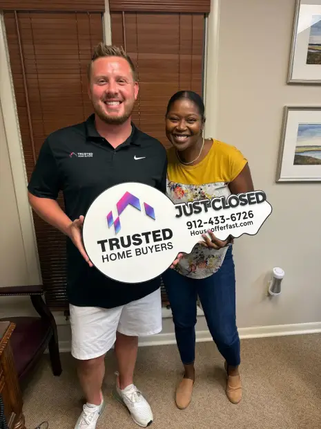 Seller who sold their property to Trusted Home Buyers, pictured at closing
