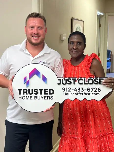 Seller who sold their property to Trusted Home Buyers, pictured at closing
