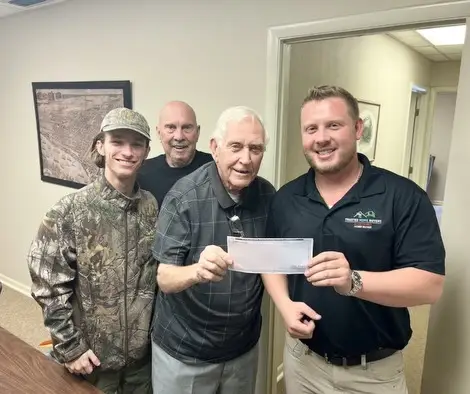 Seller who sold their property to Trusted Home Buyers, pictured at closing