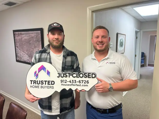 Seller who sold their property to Trusted Home Buyers, pictured at closing