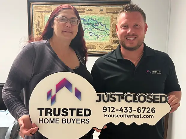 Seller who sold their property to Trusted Home Buyers, pictured at closing